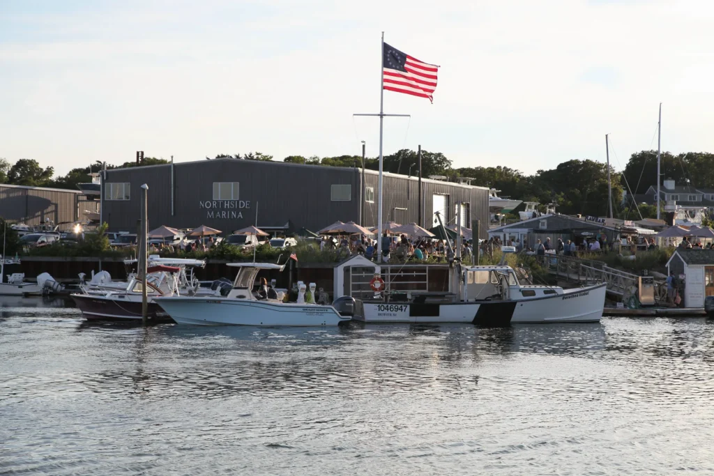 American flag over Northside Marina at Sesuit Harbor in East Dennis, Massachusetts.