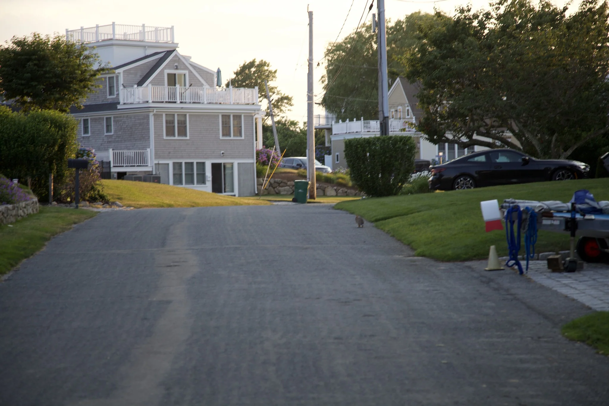 Quiet village street in Hyannis Port lined with shingled Cape-style homes