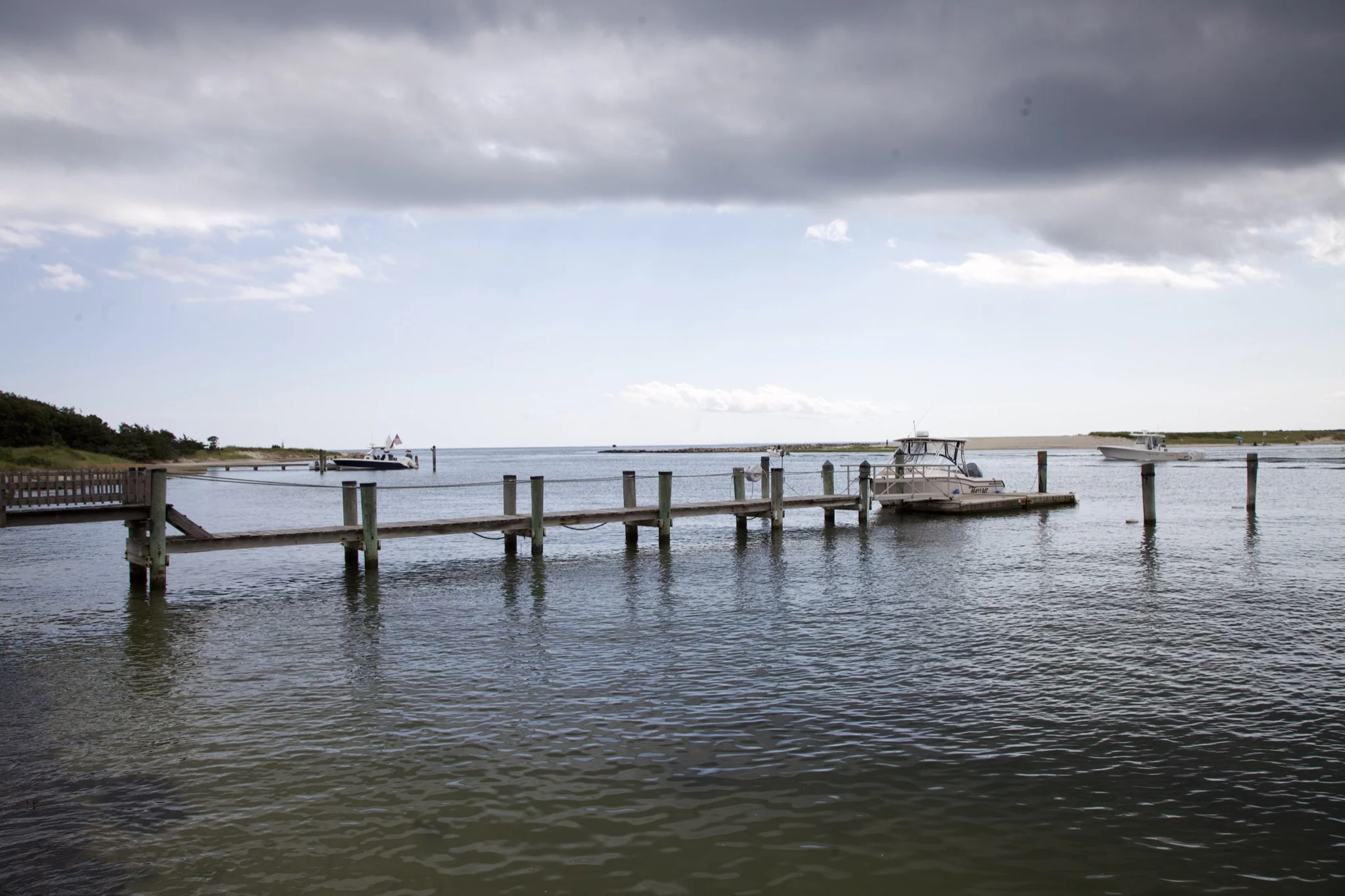 Wooden dock reaching into the harbor at Osterville, Barnstable, Massachusetts