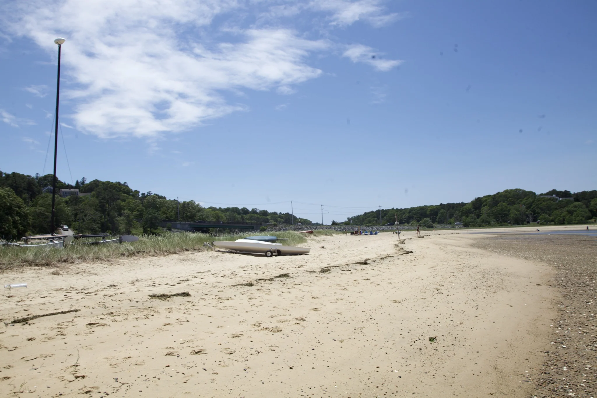 Boats hauled up on the beach beside the tidal channel in Chatham, Massachusetts