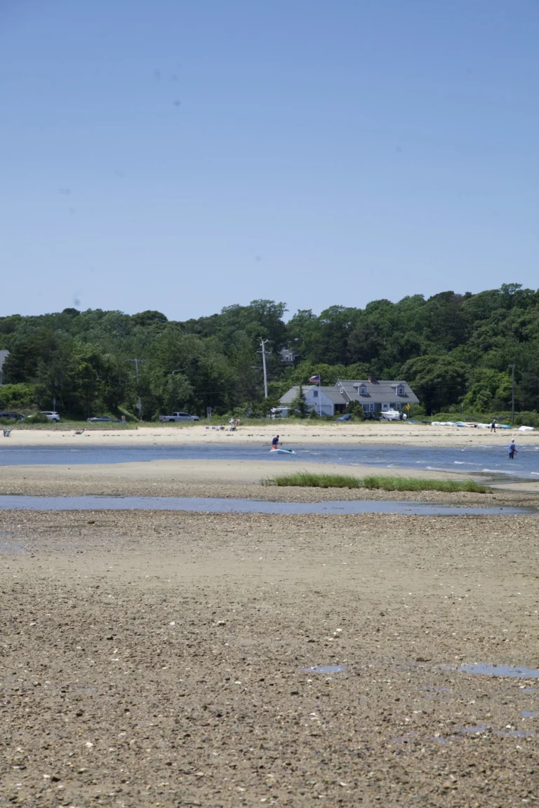 House on the far shore seen across the tidal flats in Chatham, Massachusetts