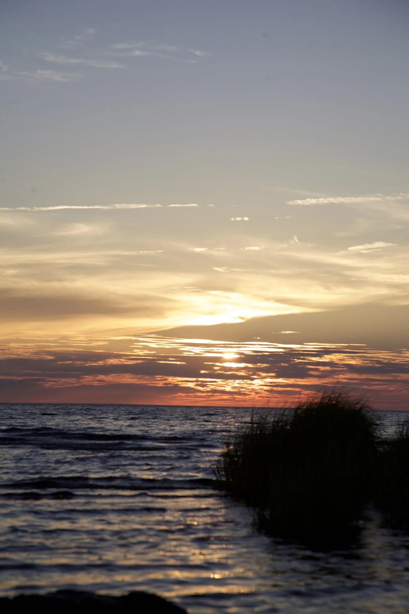 Sunset over Cape Cod Bay from the tidal flats at Skaket Beach in Orleans